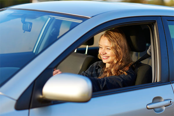 Image of a teenager driving a car
